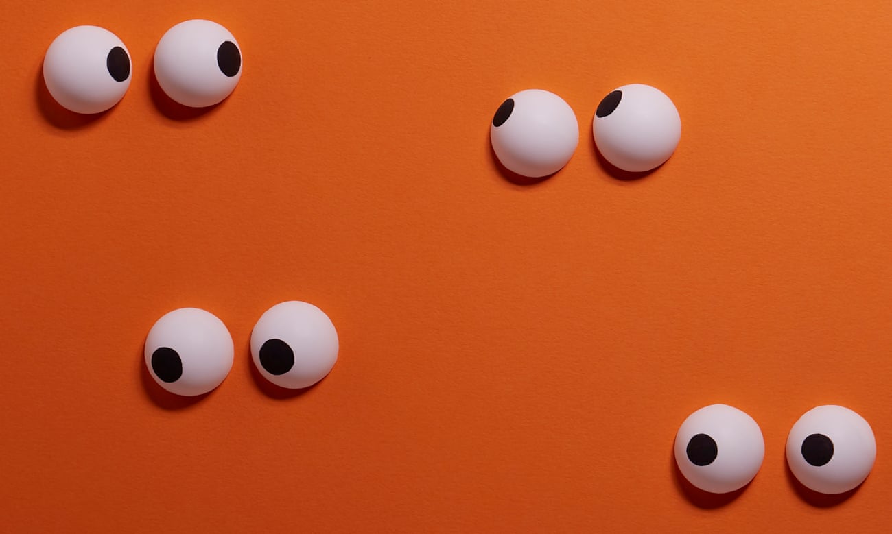 An illustration of pairs of eyes on an orange background