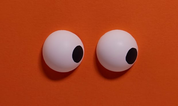 A pair of eyes on an orange background