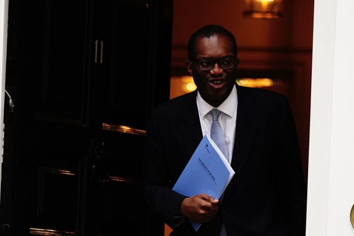 Kwasi Kwarteng leaving No 11 this morning, holding a copy of the growth plan he will announce to MPs.
