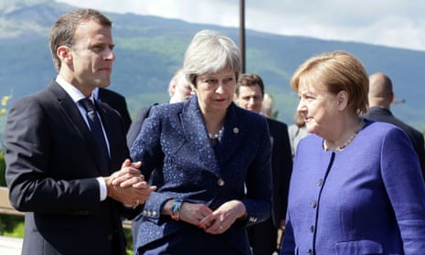Theresa May alongside the French president Emmanuel Macron and German chancellor Angela Merkel