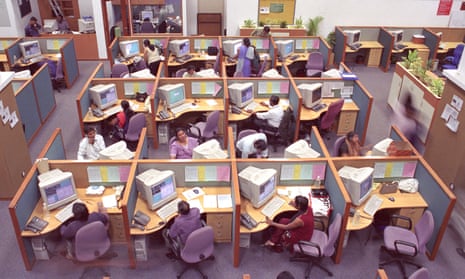 Employees at a call center in Bangalore, in cubicles