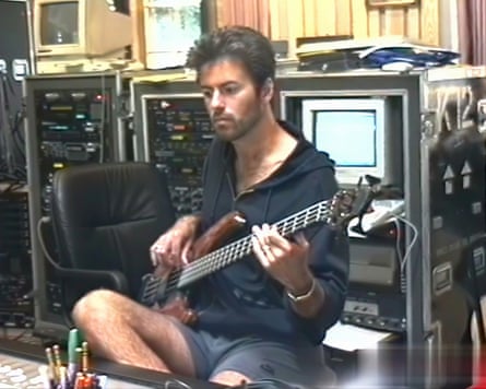 George Michael plays bass in the studio in the mid 1990s.