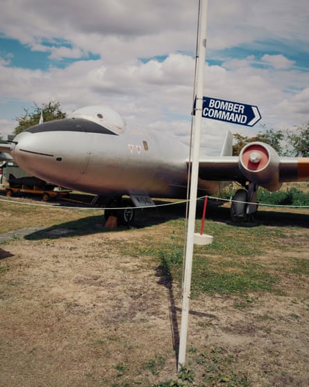A vintage plane with a sign to bomber command