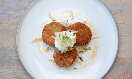 Crab and chilli fishcakes on a round white plate