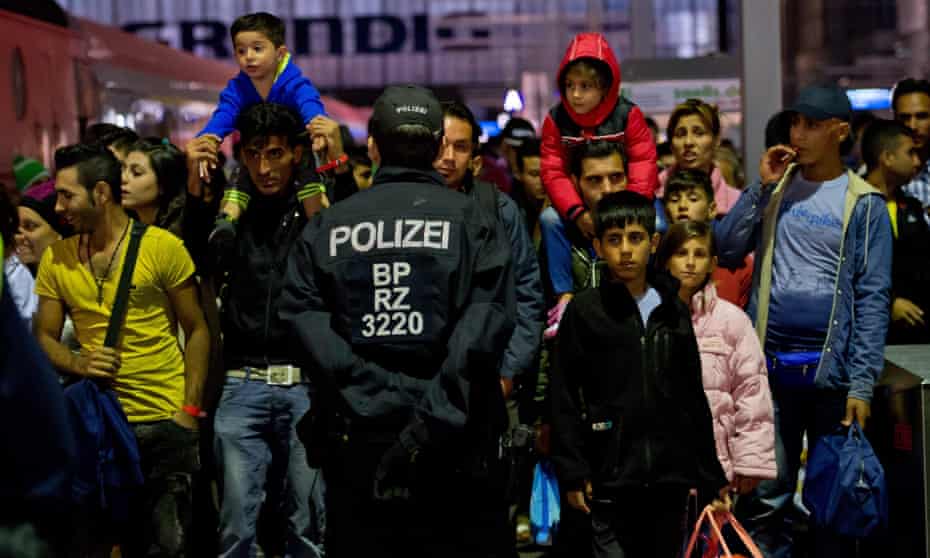 Refugees arrive at the main station in Munich, Germany.