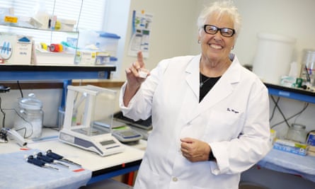 Loretta Mayer, CEO of SensTech, holds up a test cup of the company’s rat contraceptive formula.