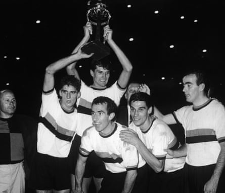 Armando Picchi, captain of Internazionale, celebrates his team’s win in the World Club Championship at the Santiago Bernabeu Stadium in Madrid, 26th September 1964. Holding the cup is teammate Giacinto Facchetti.