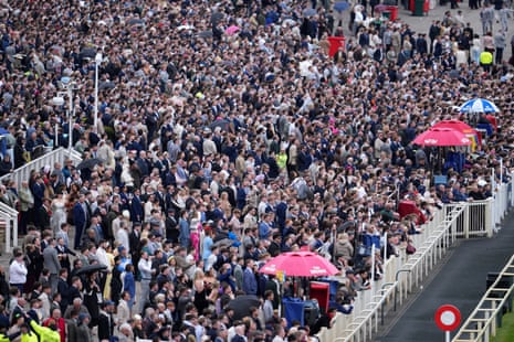 Racegoers pack the stands at the Grand National horse meeting at Aintree.