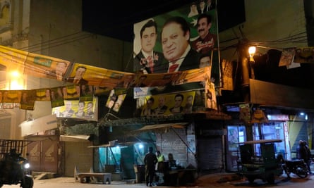 An election campaign poster for the party of Pakistan's former prime minister Nawaz Sharif is displayed at a market in Lahore, 5 February 2024.