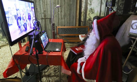 A person dressed as Samichlaus (Swiss Santa) interacts with children via video at a studio of the St. Nikolausgesellschaft Zurich, as the spread of the coronavirus disease (COVID-19) continues, in Zurich, Switzerland.
