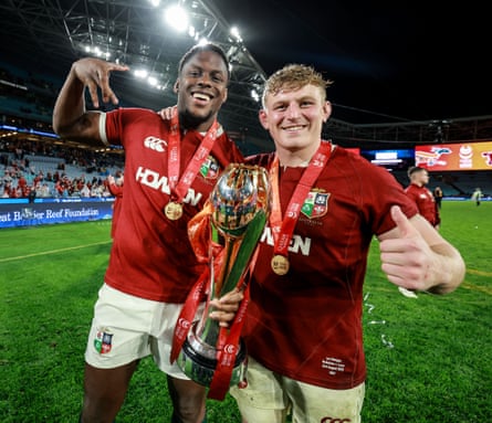 Maro Itoje and Jac Morgan celebrate the Lions’s series victory with the trophy