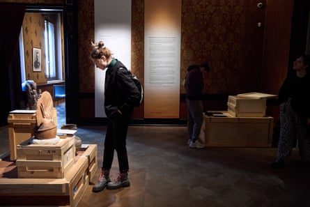A woman looking at an exhibit
