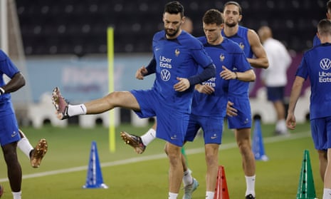Hugo Lloris and his France teammates warm up before training at Al Sadd Sports Club Stadium in Doh