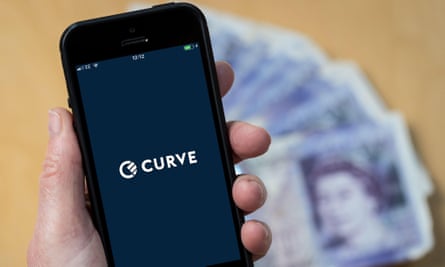 Someone uses the Curve banking app on a mobile phone.