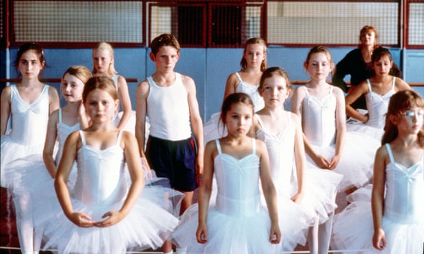 A scene from Billy Elliot showing a class full of girls and Billy.