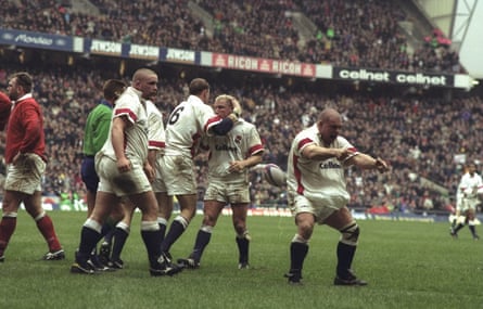 England celebrate on their way to a 60-26 humbling of Wales in February 1998 at Twickenham.