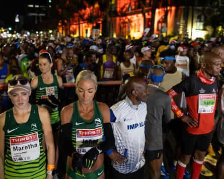 Athletes gather in the dark before the start of the Comrades Marathon in Durban