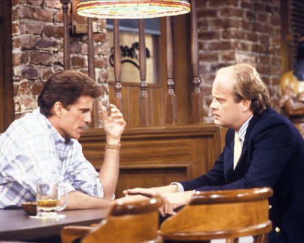 Two men sit in a bar