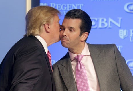 Donald Trump kisses his son Donald, Jr. at a campaign event at Regents University in Virginia Beach, Virginia.