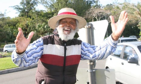 Johnny Barnes greeting commuters from his roundabout in Bermuda.