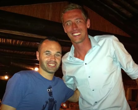 Peter Crouch’s holiday snap with Andrés Iniesta that is the subject of a running jokes in his podcast.