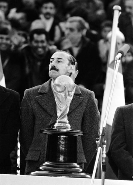Argentina president Jorge Videla looks at the World Cup trophy on display at the 1978 World Cup final
