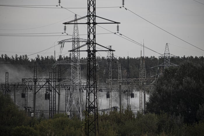 Smoke rises over Kharkiv's western outskirts as firefighters put out the fire after a Russian rocket attack hit an electric power station in Kharkiv.