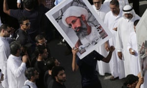Saudis carry a poster of Sheikh Nimr al-Nimr be freed last May as they protested for him to be released