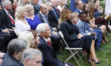 Karen and Mike Pence sit across the aisle from Melania Trump and Barrett’s family as Barrett speaks.