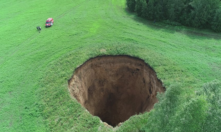 A 50m-deep sinkhole in the Nizhny Novgorod region of Russia. Photograph: Tass