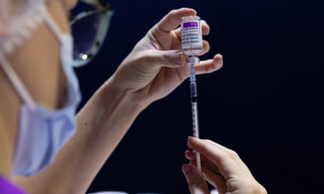 A nurse fills a syringe with a Covid vaccine