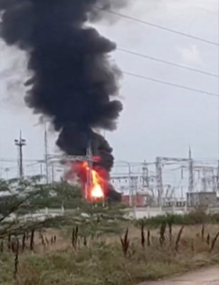 Smoke rises above a transformer electric substation, which caught fire after a blast in Dzhankoi, Crimea, on 16 August.