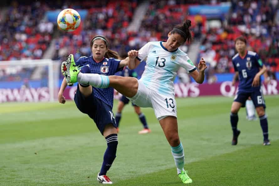 Argentina’s defender Virginia Gomez vies with Japan’s midfielder Yui Hasegawa.