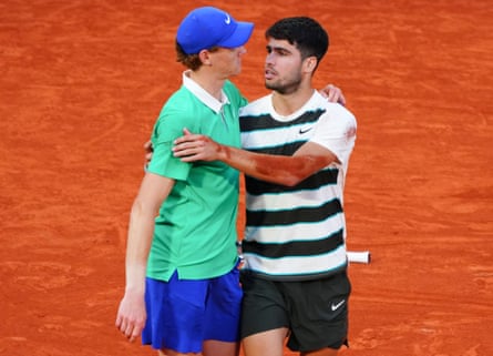 Jannik Sinner and Carlos Alcaraz hug after their five-set French Open final.