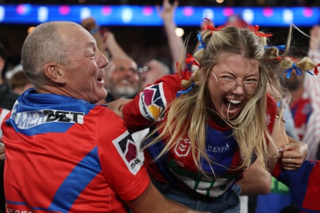 Knights supporters cheer on their side in the grand final