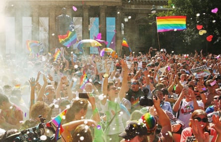 A crowd celebrates the results of the postal survey in front of the State Library of Victoria Wednesday.