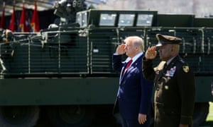 Donald Trump salutes with US Army Lt Gen Darryl Williams at West Point’s graduation ceremony on Saturday.