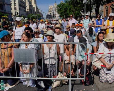 People kneeling behind barriers