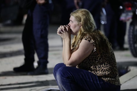 A woman sits alone