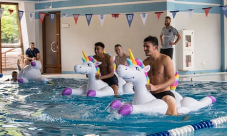 Team bonding … Kieran Trippier, Jesse Lingard, Jordan Pickford and Harry Maguire play with inflatable unicorns.