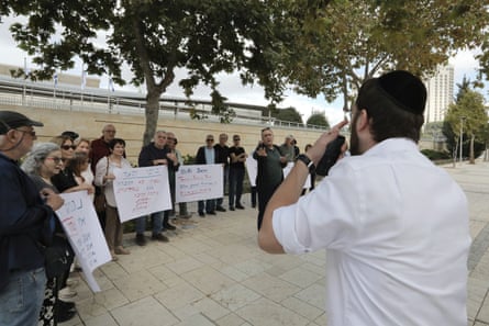 An orthodox Israeli confronts former Israeli ambassadors and employees outside the foreign ministry in Jerusalem