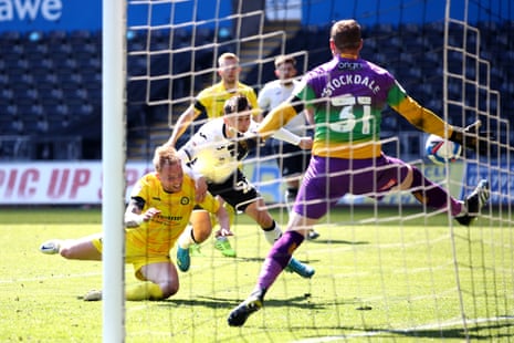 Liam Cullen of Swansea City heads past Wycombe keeper David Stockdale for the equaliser, which puts Norwich back in the Premier League.