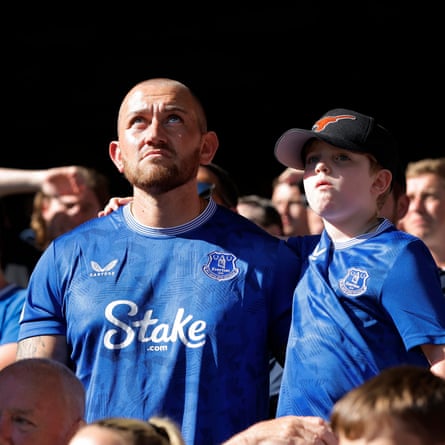A father and son in the lower Gwladys Street Stand look dejected late in the game against Ipswich