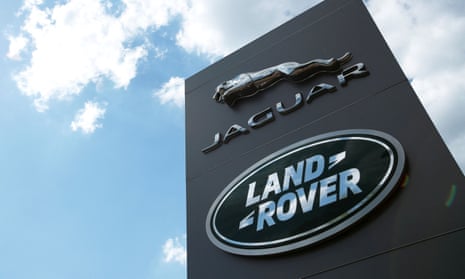 The Jaguar Land Rover logo at a dealership.