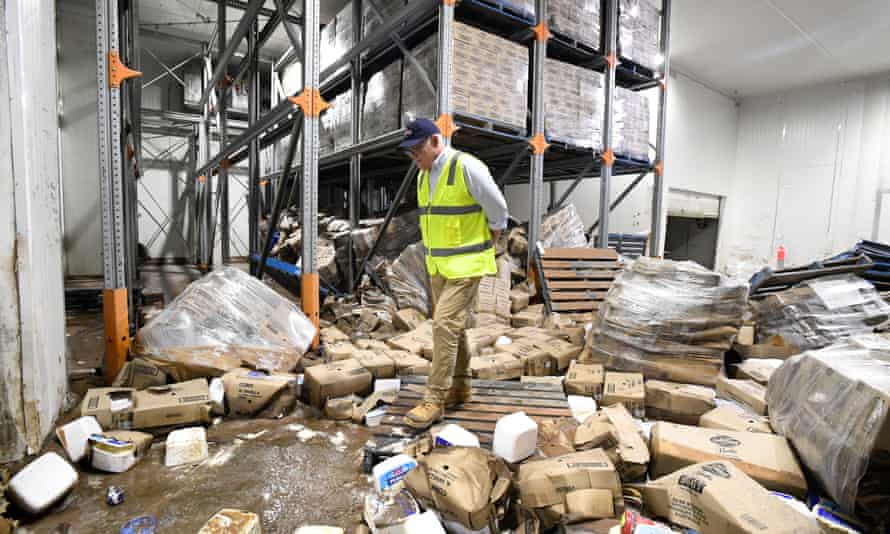 Scott Morrison surveys the damage at Norco’s ice-cream factory in Lismore on Wednesday.