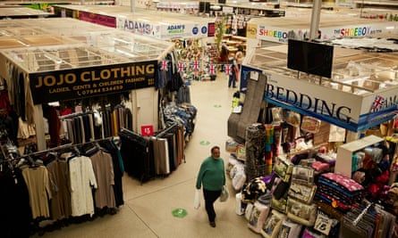 Traders and shoppers at the indoor market in Bolton.