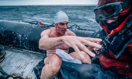 Deep down cold: Lewis Pugh climbs on to his support boat after swimming in the Ross Sea in 2015.