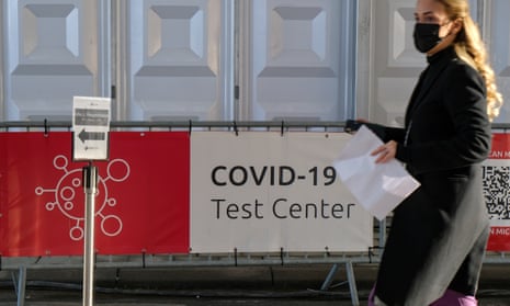 A woman in central Brussels heads towards a Covid test centre