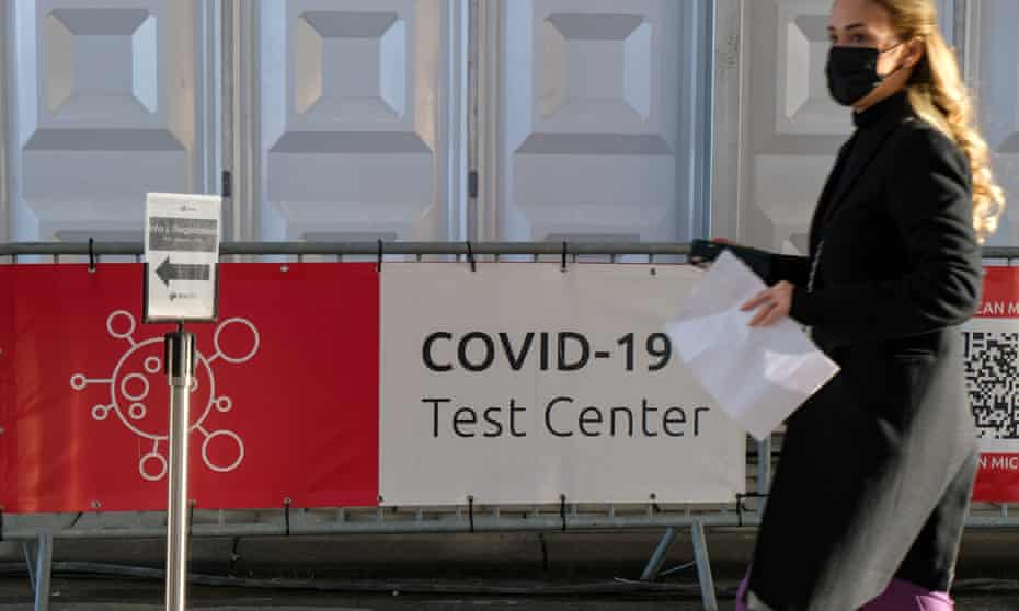 A woman in central Brussels heads towards a Covid test centre