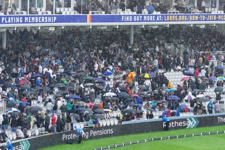 Rain falls on spectators at Lord’s